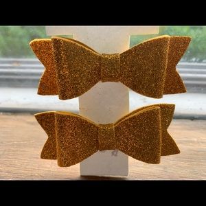 Pair of gold hair bows